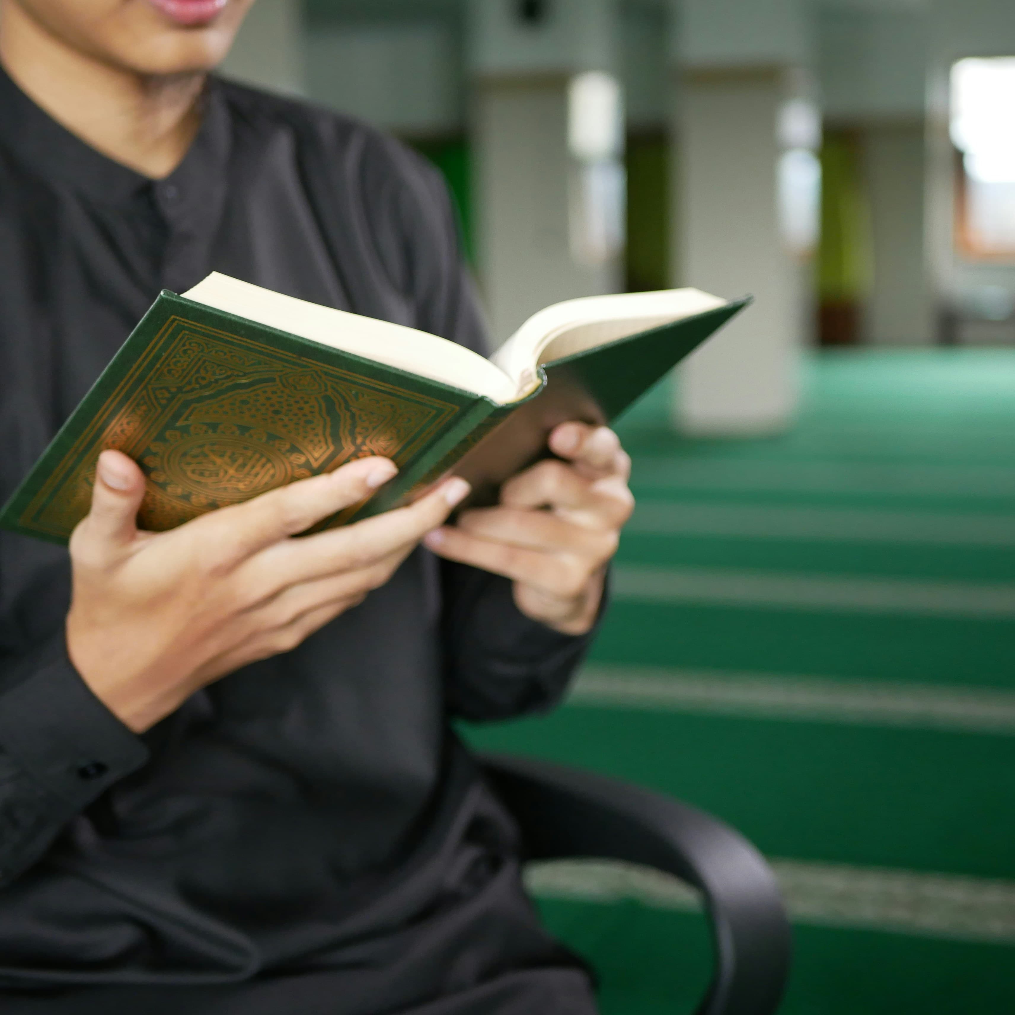 A student reading the Holy Quran